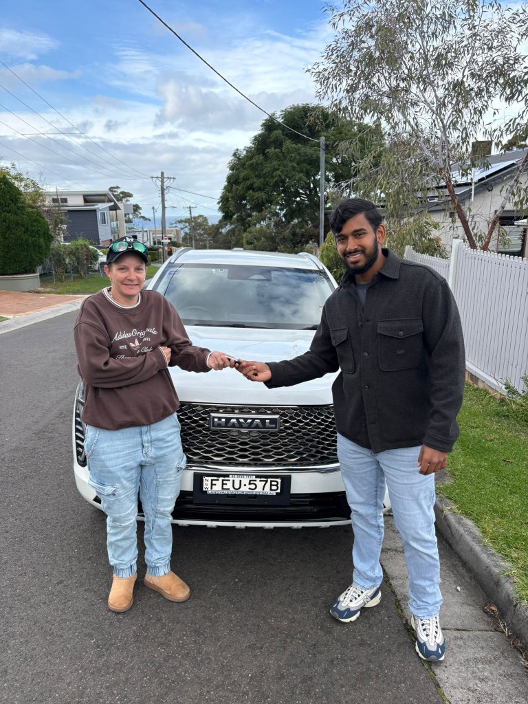 A customer collecting their car at a Car Rentals Near Me handover