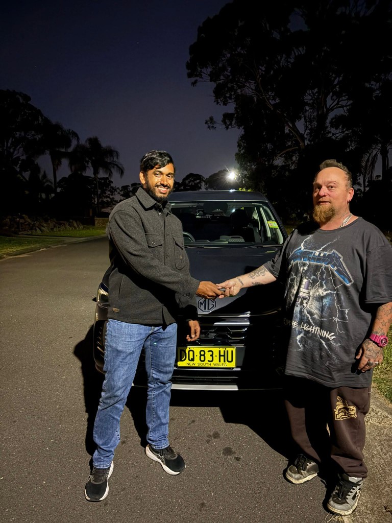 A customer collecting their car at a Car Rentals Near Me handover