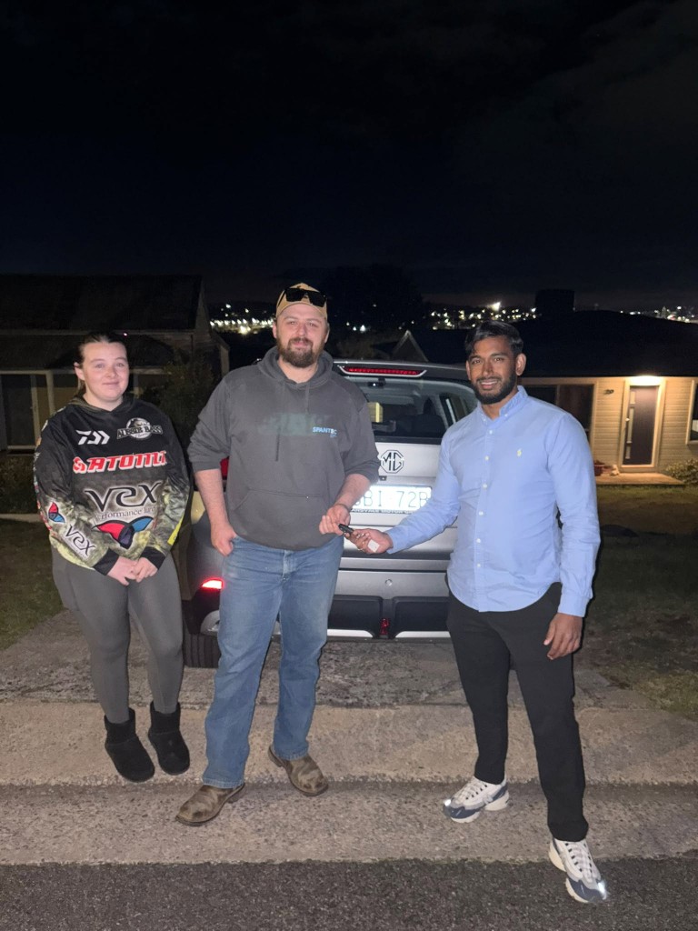 A customer collecting their car at a Car Rentals Near Me handover