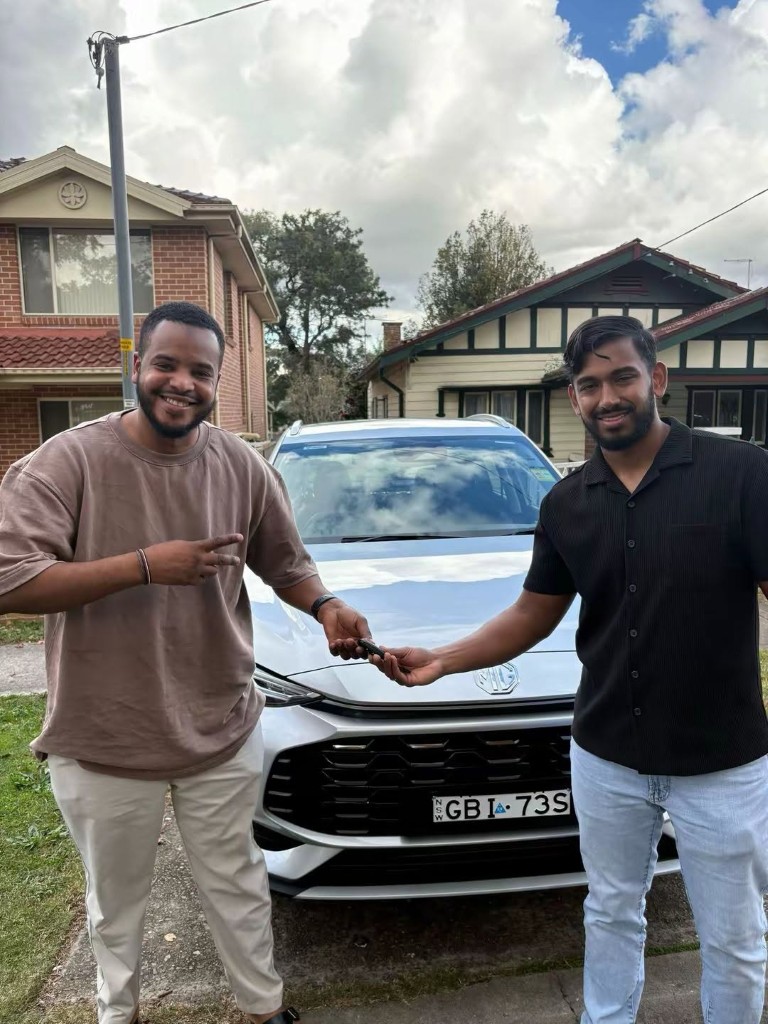 A customer collecting their car at a Car Rentals Near Me handover