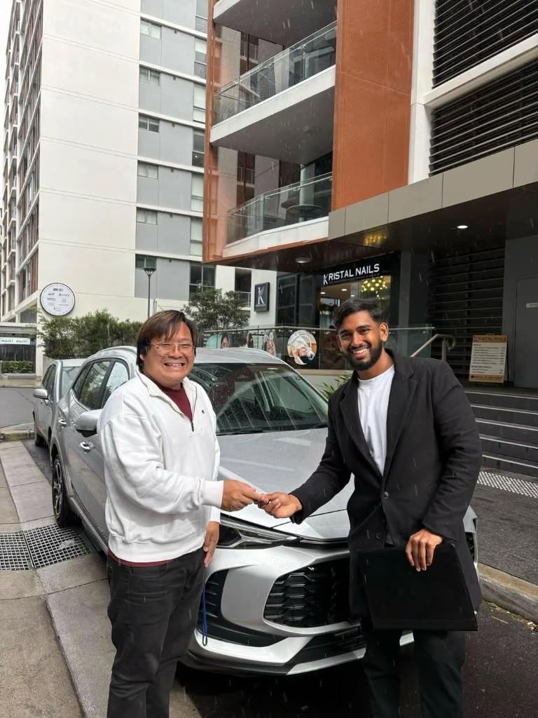 A customer collecting their car at a Car Rentals Near Me handover