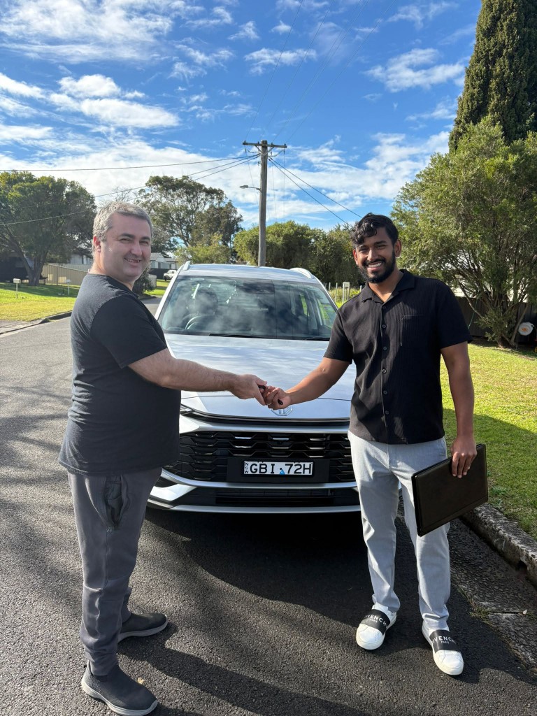 A customer collecting their car at a Car Rentals Near Me handover