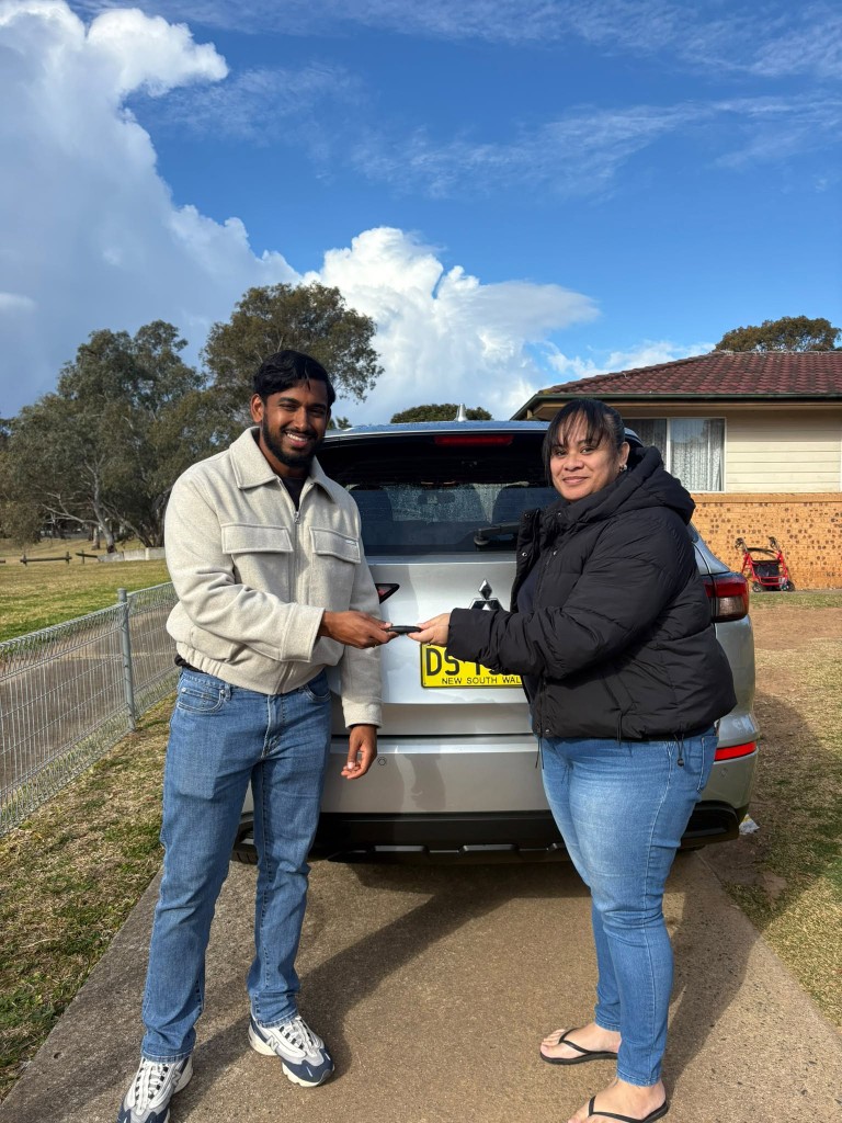 A customer collecting their car at a Car Rentals Near Me handover