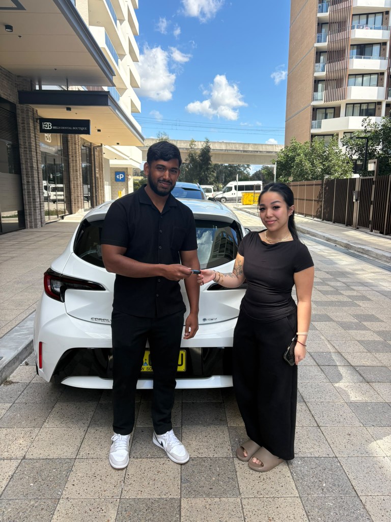 A customer collecting their car at a Car Rentals Near Me handover