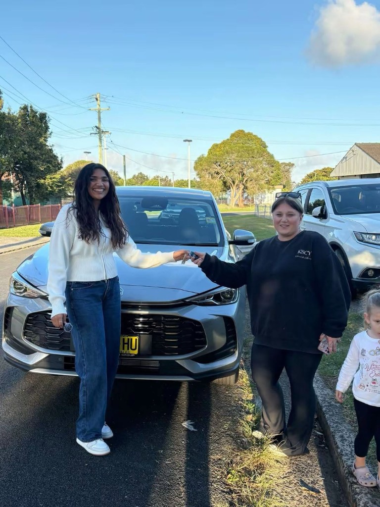A customer collecting their car at a Car Rentals Near Me handover